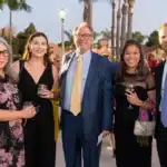 HTH Founder Gary S. Jacobs shares a moment with community partners at the 25th Anniversary Gala.