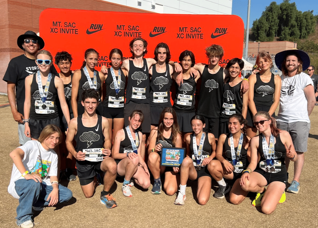 Cross-country team members pose with their medals following a meet.