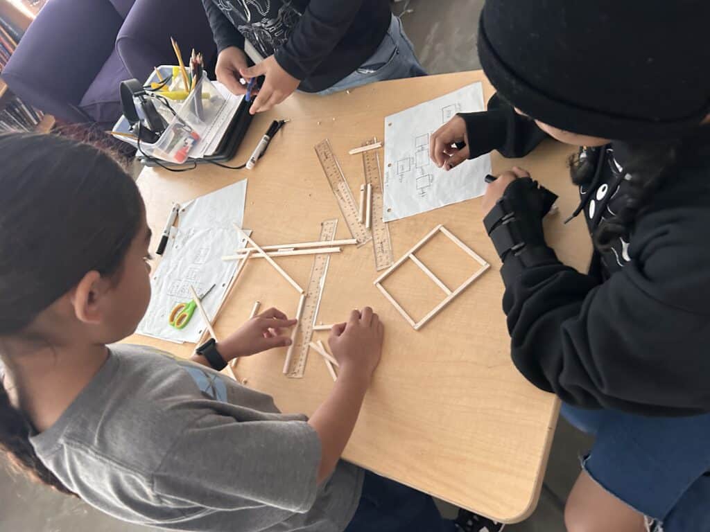 Students work on hands-on project together.