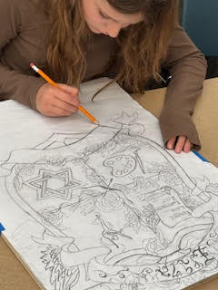 A student sketches a coat of arms.