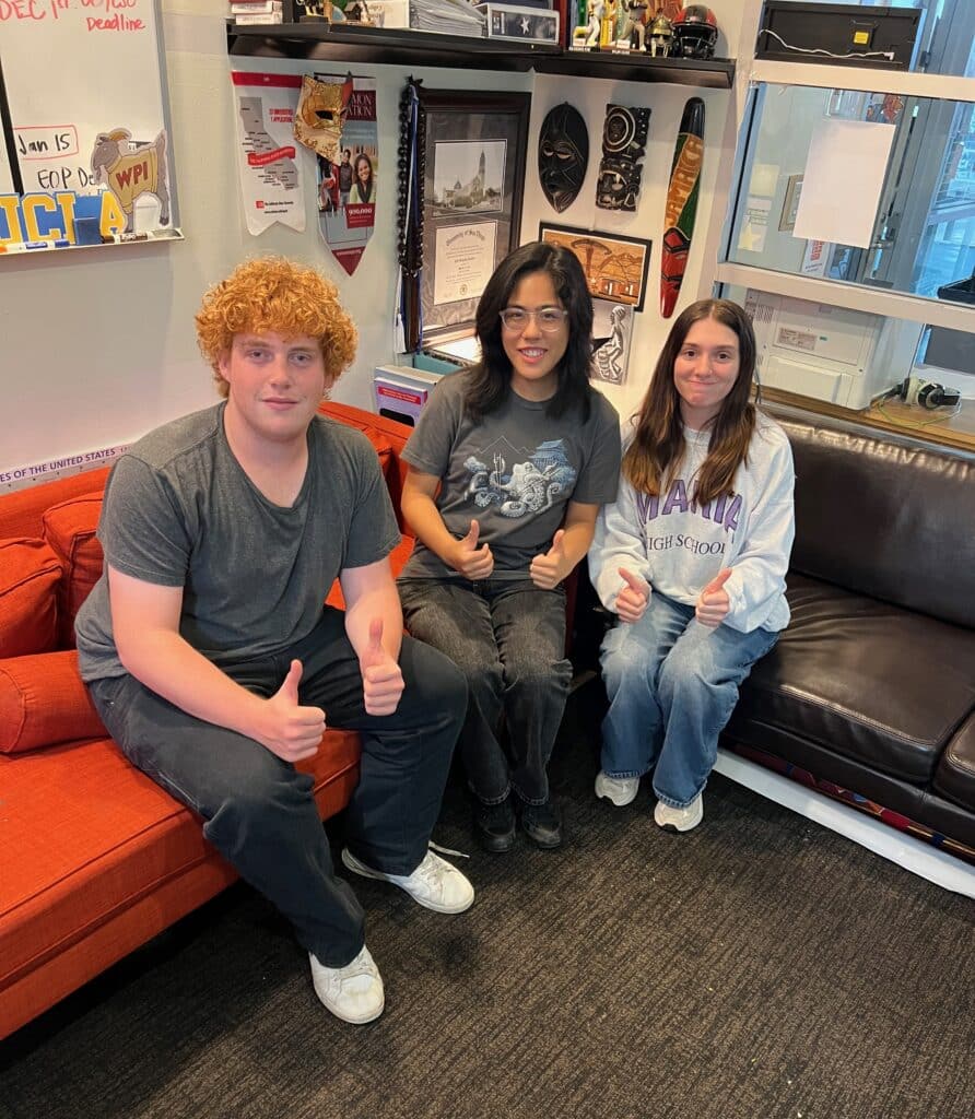 Students in HTHI's Study Abroad Club are seated together and shared reflections on summer program.