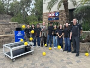 HTH robotics students share a moment with news personality Paul Rudy on Good Morning San Diego.